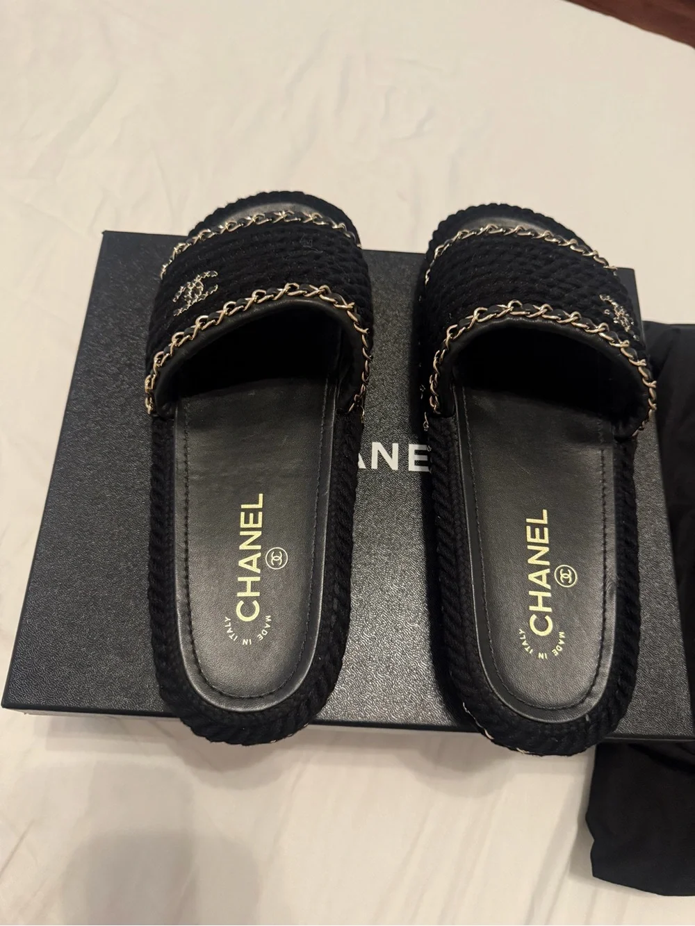 CHANEL Black Braided Slides with Gold Chain Accents